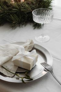 Kaboompics - Close Up Crystal Coupe Glasses, Silver Bowls and Evergreen Advent Wreath
