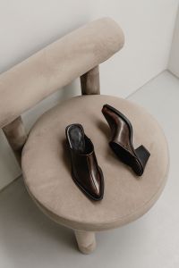 Kaboompics - Brown Leather Shoes on Beige Stool Close-Up