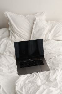 Work from Bed Lifestyle: Laptop, Remote Work and Home Office on White Cotton Bedding