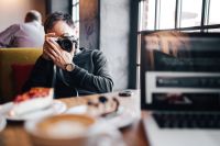 Kaboompics - Young man taking photo with vintage camera