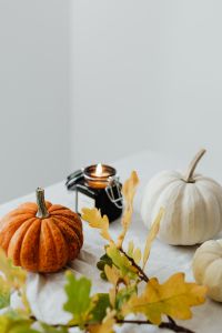Kaboompics - Autumn Arrangement of Pumpkins, Candle and Golden Oak Leaves