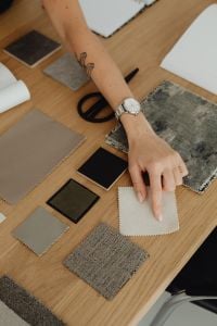 Kaboompics - Overhead View of Hand Selecting Fabric Samples