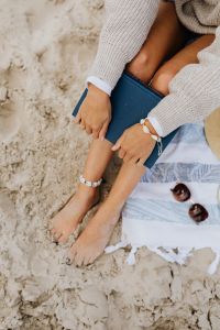 Kaboompics - Summer Beach Lifestyle Portrait with Book and Straw Hat