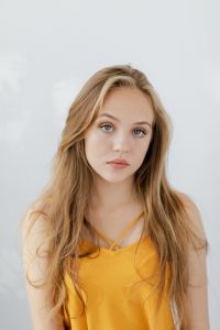 Kaboompics - Blonde Teen Girl in Mustard Yellow V-Neck Top