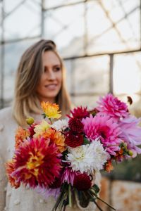 Kaboompics - Woman Holding Mixed Dahlia Bouquet