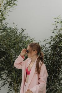 Kaboompics - Close-Up of Woman Adjusting Sunglasses in a Pale Pink Blazer