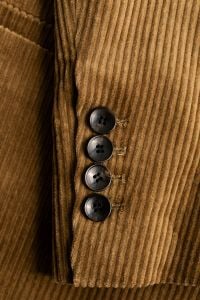 Kaboompics - Camel Corduroy Blazer Sleeve with Four Dark Buttons, Ribbed Tailoring Detail Close-Up