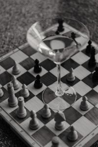 Kaboompics - Black and White Chessboard With Cocktail Glass