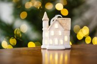 Kaboompics - White Christmas House Ornament with Warm Lights