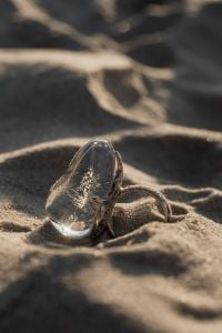 Kaboompics - Silver Ring on Beach Sand beside the Water, Shallow Focus