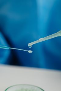 Kaboompics - Laboratory Dropper on Blue Background With Copy Space
