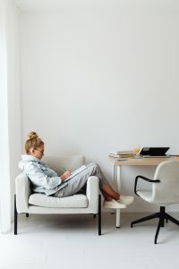 Kaboompics - Home Learning Student Writing in Armchair with Copy Space
