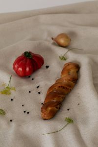 Kaboompics - Red Tomato, Shallots and Sliced Bread on Linen