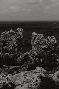 Kaboompics - Black and White Coastal Seascape with a Distant Sailboat