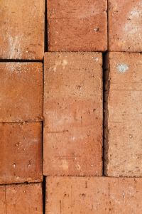 Kaboompics - Terracotta Stacked Brick Wall with Weathered Texture