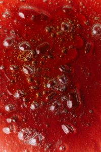 Kaboompics - Red Skincare Liquid with Bubbles
