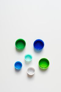 Kaboompics - Scattered Blue, Green and Turquoise Bottle Caps