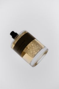 Kaboompics - Cosmetic Spray Bottle With Golden Liquid Texture