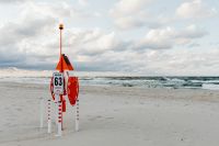 Kaboompics - Red Lifeguard Station and Rescue Buoy on Jurata Beach, Baltic Sea