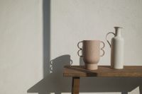 Kaboompics - Wooden Bench with Ceramic Vase and Sculptural Mug