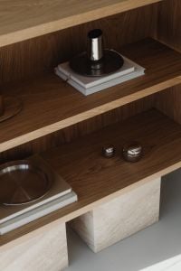 Kaboompics - Minimalist oak bookshelf with silver metal objects