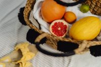 Kaboompics - Grapefruit and Orange Slices in a Wicker Beach Basket