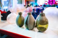 Kaboompics - Sage Green and Cream Murano Glass Vases on a Display Shelf
