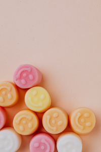 Kaboompics - Pastel Gummy Bears on Beige with Large Copy Space, Minimal Candy Background