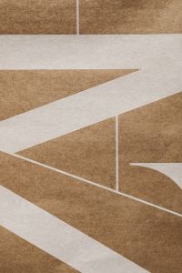 Kaboompics - Folded Brown Paper and White Geometric Paper Shapes
