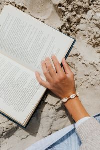 Kaboompics - Open Book on Sandy Beach Background with Copy Space