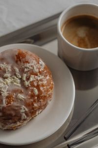 Kaboompics - Glazed Pastry with Coffee on Reflective Silver Tray