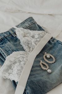Kaboompics - White Lace Top with Jeans in Feminine Fashion Flat Lay