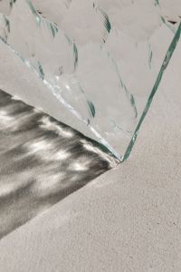 Kaboompics - Prismatic Glass Panel Casting a Shadow on a Textured Neutral Surface