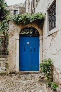 Kaboompics - Blue Door in a Weathered Stone Archway, Rovinj, Croatia