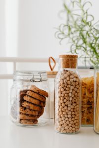 Kaboompics - Soft-Focus Rosemary and a Glass Pantry Jar on a Neutral Kitchen Counter