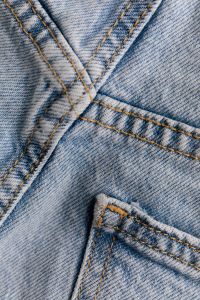 Kaboompics - Crossed Topstitched Seams and Pocket Edge on Blue Jeans, Vertical Denim Detail