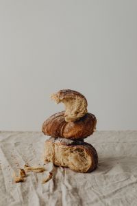 Kaboompics - Rustic Bread Stack With Torn Crumbs on Linen