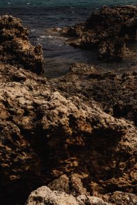 Kaboompics - Rocky Malta Cove with Dark Mediterranean Water Between Limestone Cliffs, Coastal Seascape Background for Travel and Nature