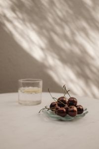 Kaboompics - Fresh Cherries on a Glass Dish with Lemon Water