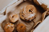 Kaboompics - Traditional Polish Pączki Donuts in Brown Paper, Fat Thursday Dessert