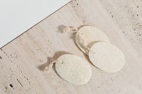 Kaboompics - Reusable Textured Cotton Face Pads on Beige Stone, Minimal Skincare Flat Lay