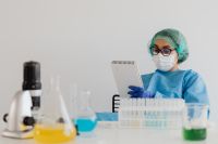 Kaboompics - Female Scientist Reviewing Experiment Notes