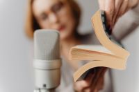 Kaboompics - Open Paperback and Studio Microphone for Close-Up Book Page ASMR Sounds