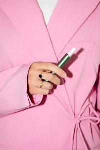 Kaboompics - Person in Pink Suit Holding a Green Pen