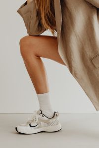 Kaboompics - White Crew Sock Styling With Trainers and a Long Beige Blazer