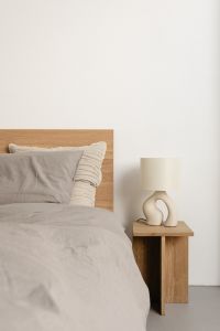 Kaboompics - Minimal Bed with Bedside Lamp and White Bedding