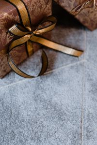 Elegantly wrapped gifts with golden ribbon