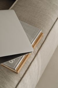 Kaboompics - Neutral Sofa Copy Space with a Laptop and Books, Minimal Work From Home Setup