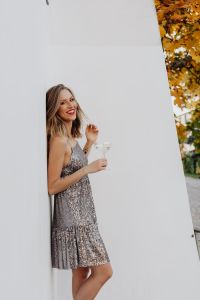 Kaboompics - Silver Sequin Cocktail Dress Portrait with Champagne and Autumn Foliage