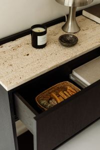 Kaboompics - Open Black Console Drawer with Woven Basket and Stacked Books